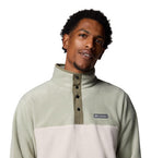 Man wearing a Columbia pullover with a white background