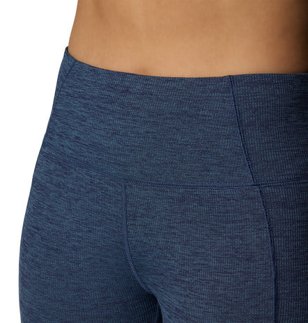 Close-up of blue leggings on a plain background
