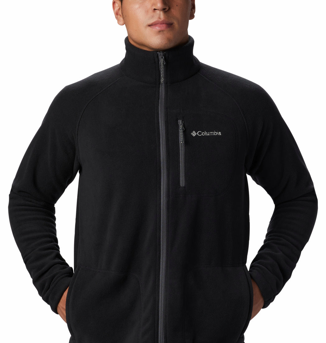 Person wearing a black fleece jacket with Columbia logo on a white background