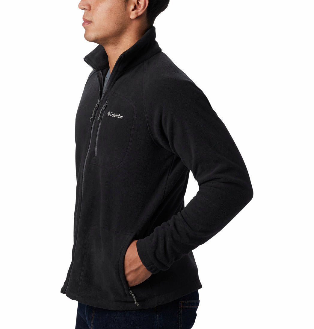Person wearing a black Columbia jacket on a white background