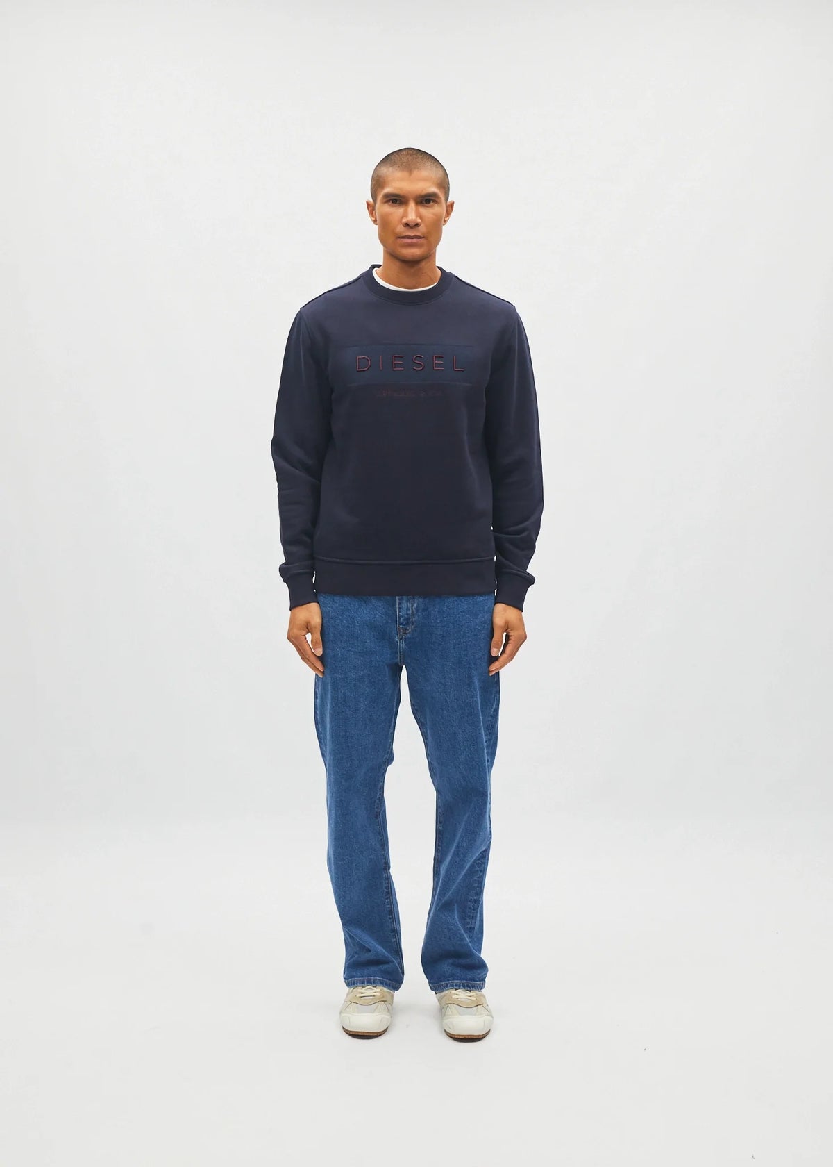 Diesel Jan Sweatshirt in Metro Navy, front model view showing the chest embroidery.