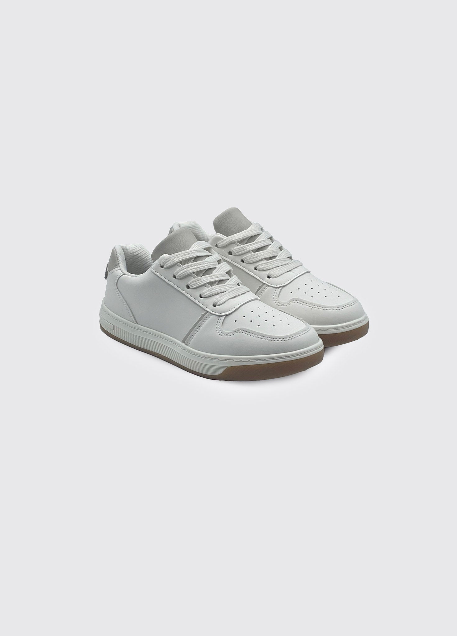 White sneakers on a light gray background