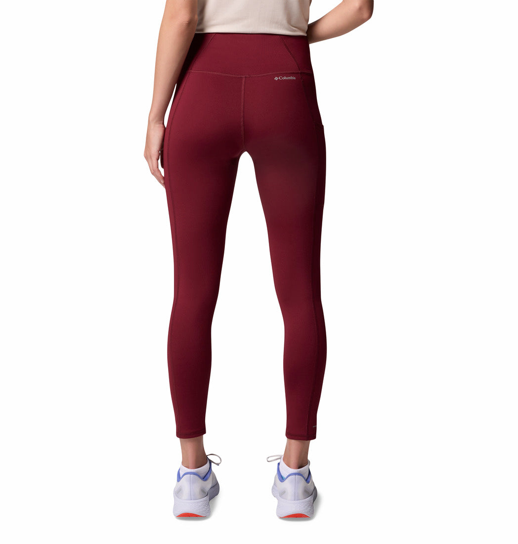 Maroon leggings worn by a person on a white background from behind