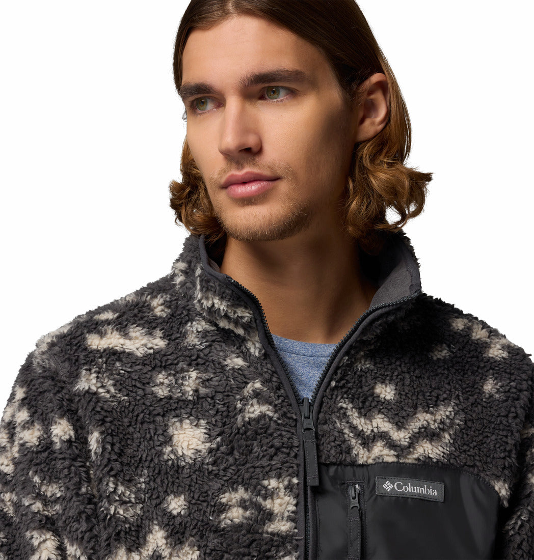 Man wearing a patterned fleece jacket with Columbia logo