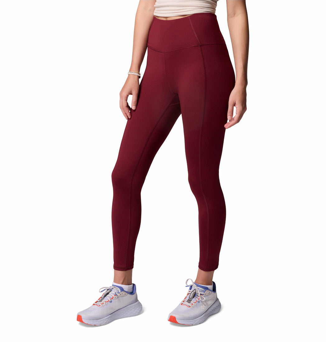 Maroon leggings worn by a person on a white background