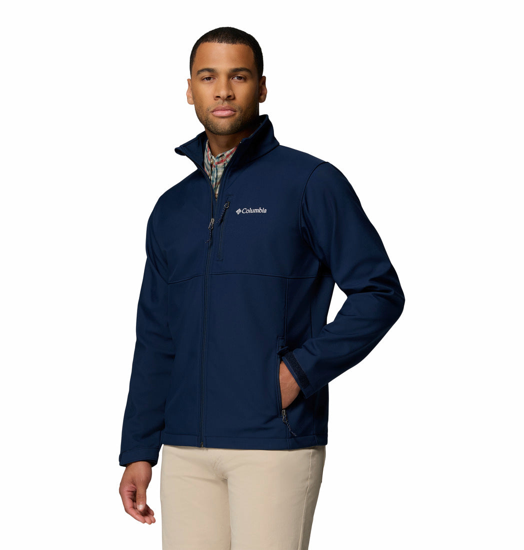 Man wearing a navy blue jacket with Columbia logo on a white background