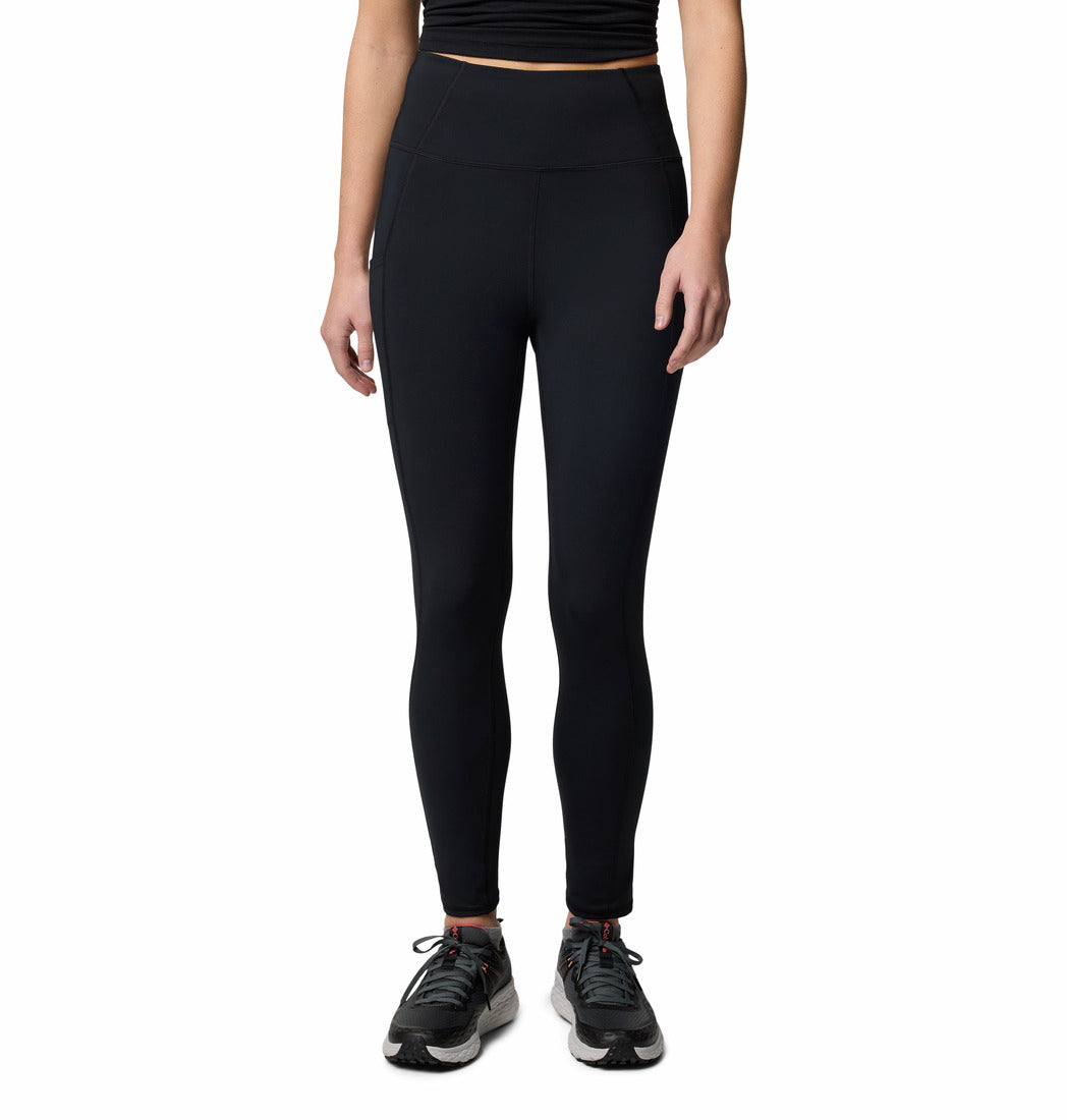 Person wearing black leggings on a white background