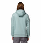 Man wearing a light blue hoodie with Columbia logo on a white background-Back view