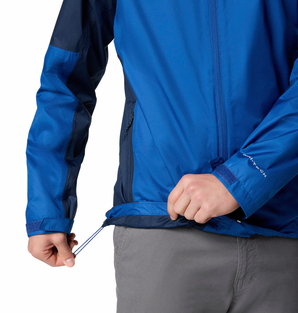Blue jacket with a person adjusting the waistband on a white background