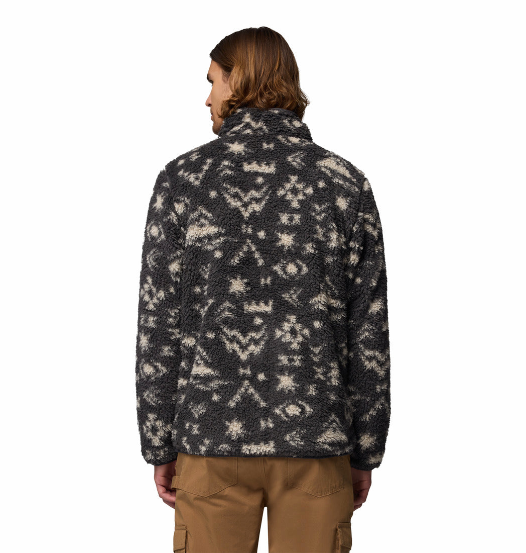 Person wearing a patterned jacket on a white background