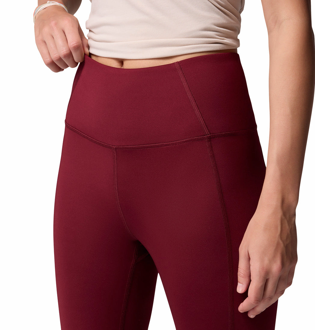 Maroon leggings worn by a person on a white background
