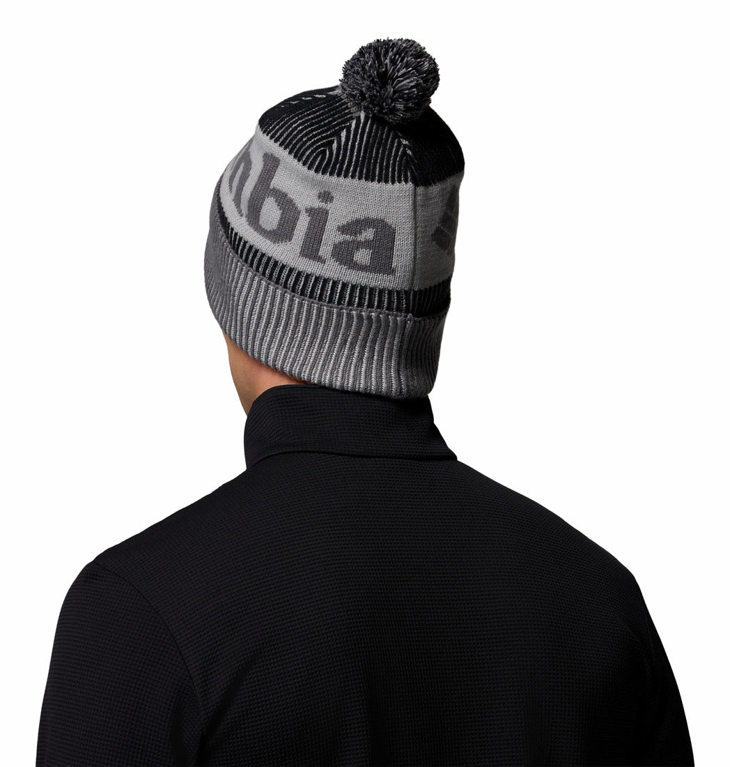 Person wearing a gray and black beanie with 'Columbia' branding on a white background