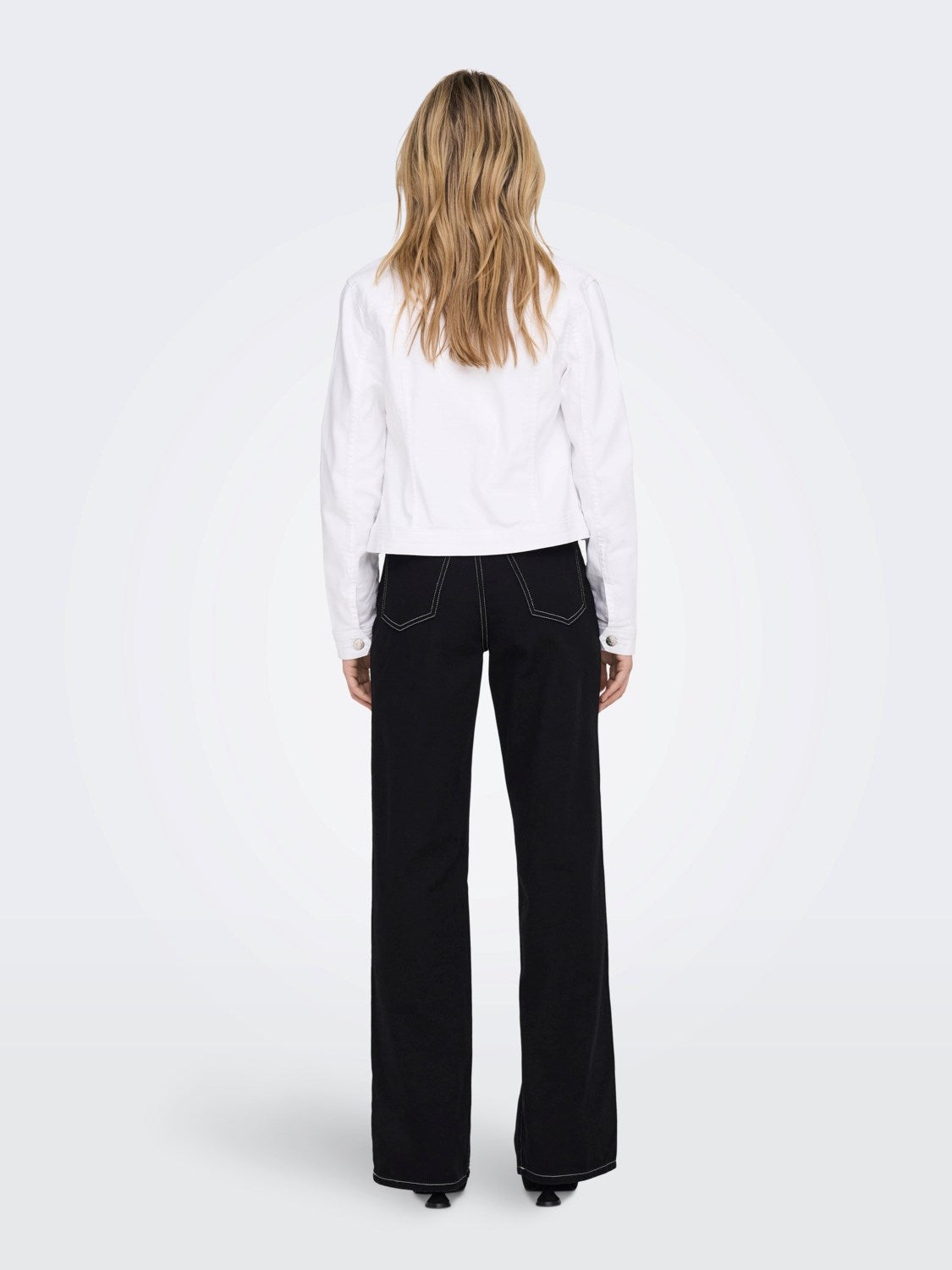 Back view of the ONLY Wonder white denim jacket on model