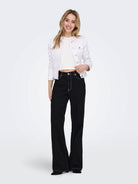 Full-length front view of the ONLY Wonder white denim jacket on model