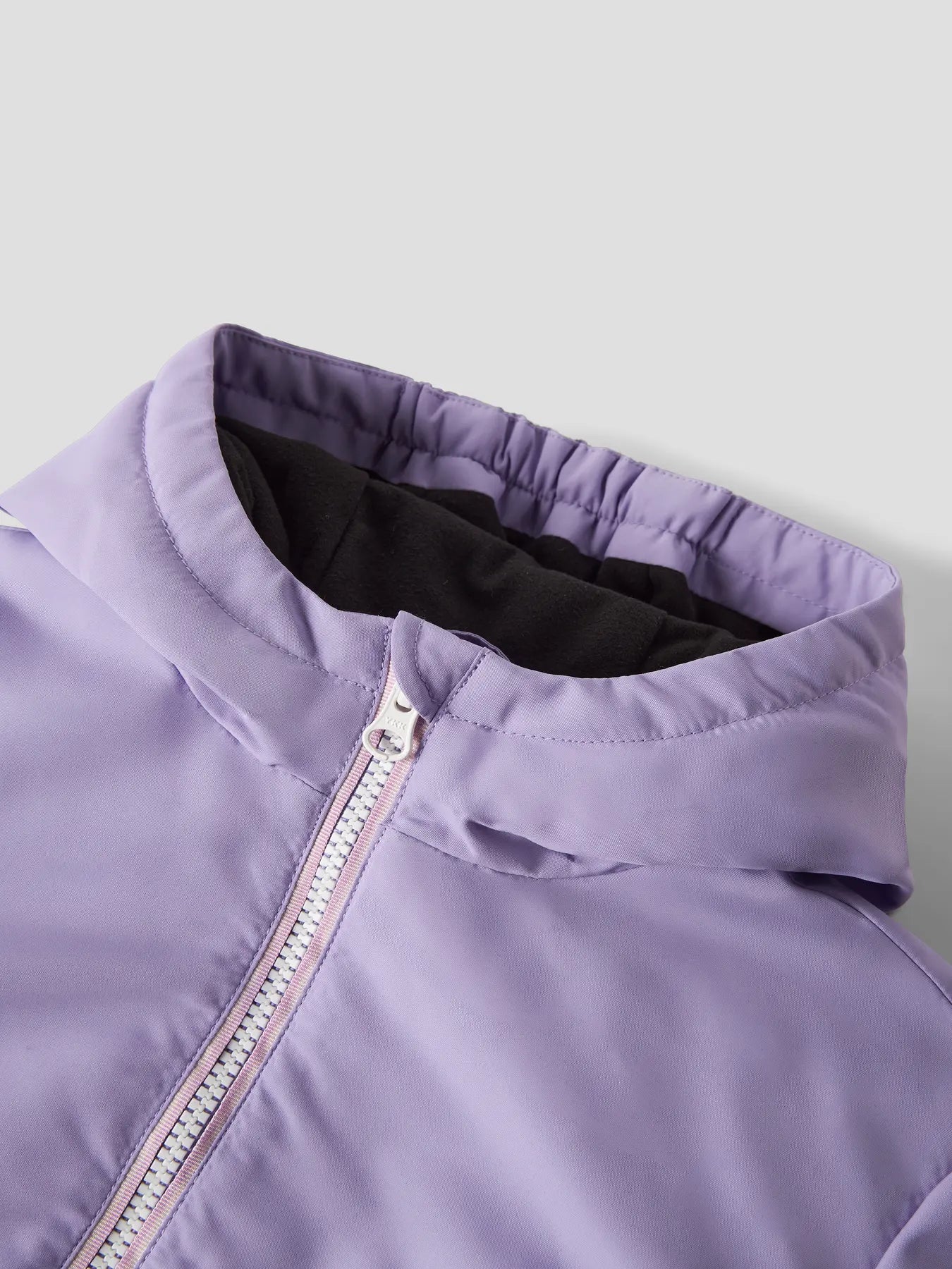 Detail of NAME IT Assimo jacket zip, pocket and recycled polyester fabric