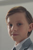 Video of boy wearing a light blue blazer