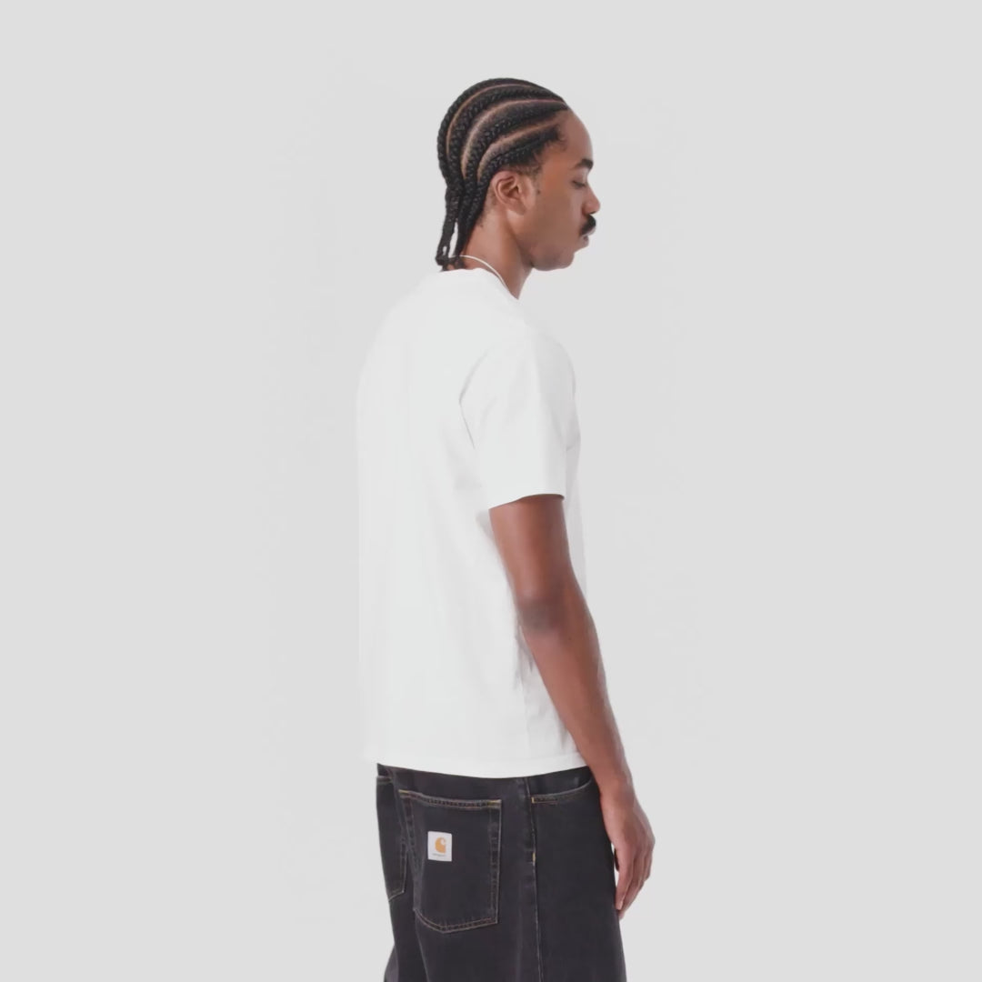 Man wearing a white short sleeve base tee with black jeans on