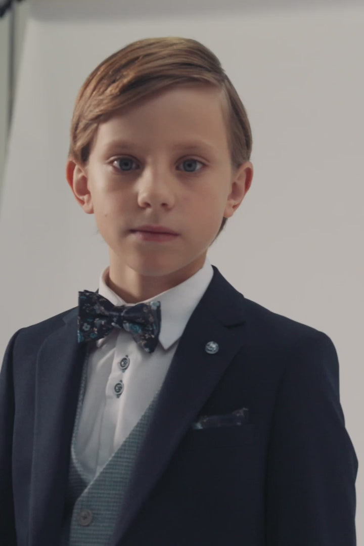 Boy wearing a blue check waistcoat