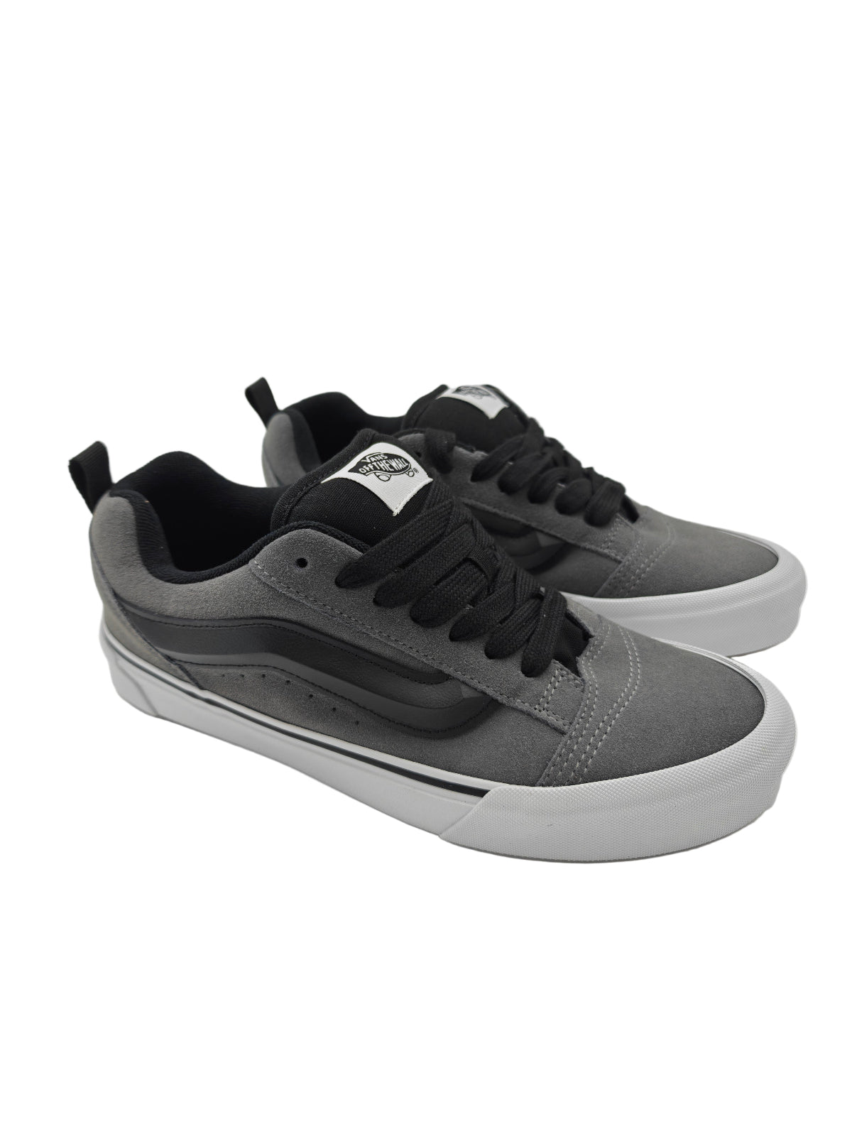 Gray and black sneakers on a white background