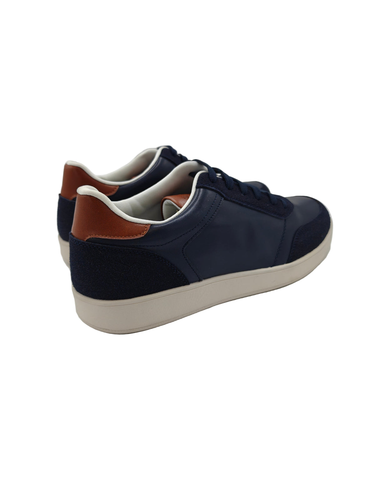 Navy blue sneakers with white soles on a white background
