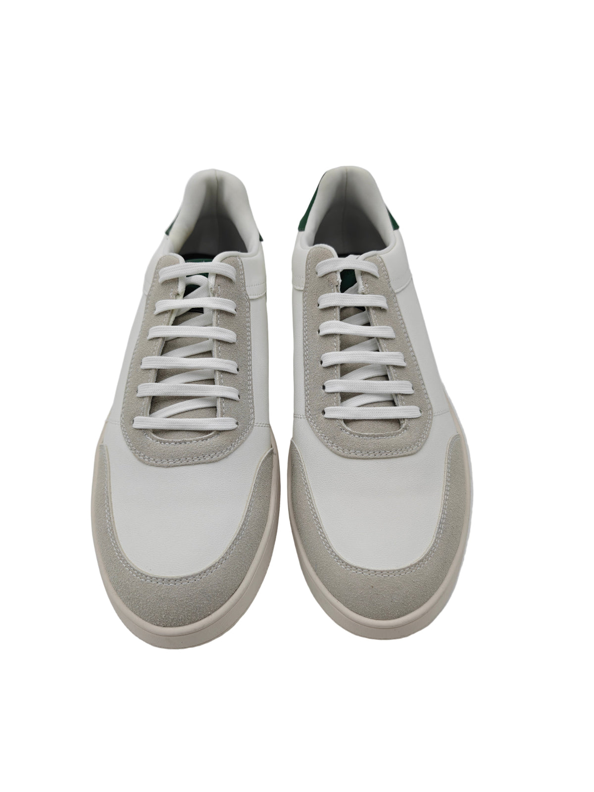 Pair of white sneakers on a white background