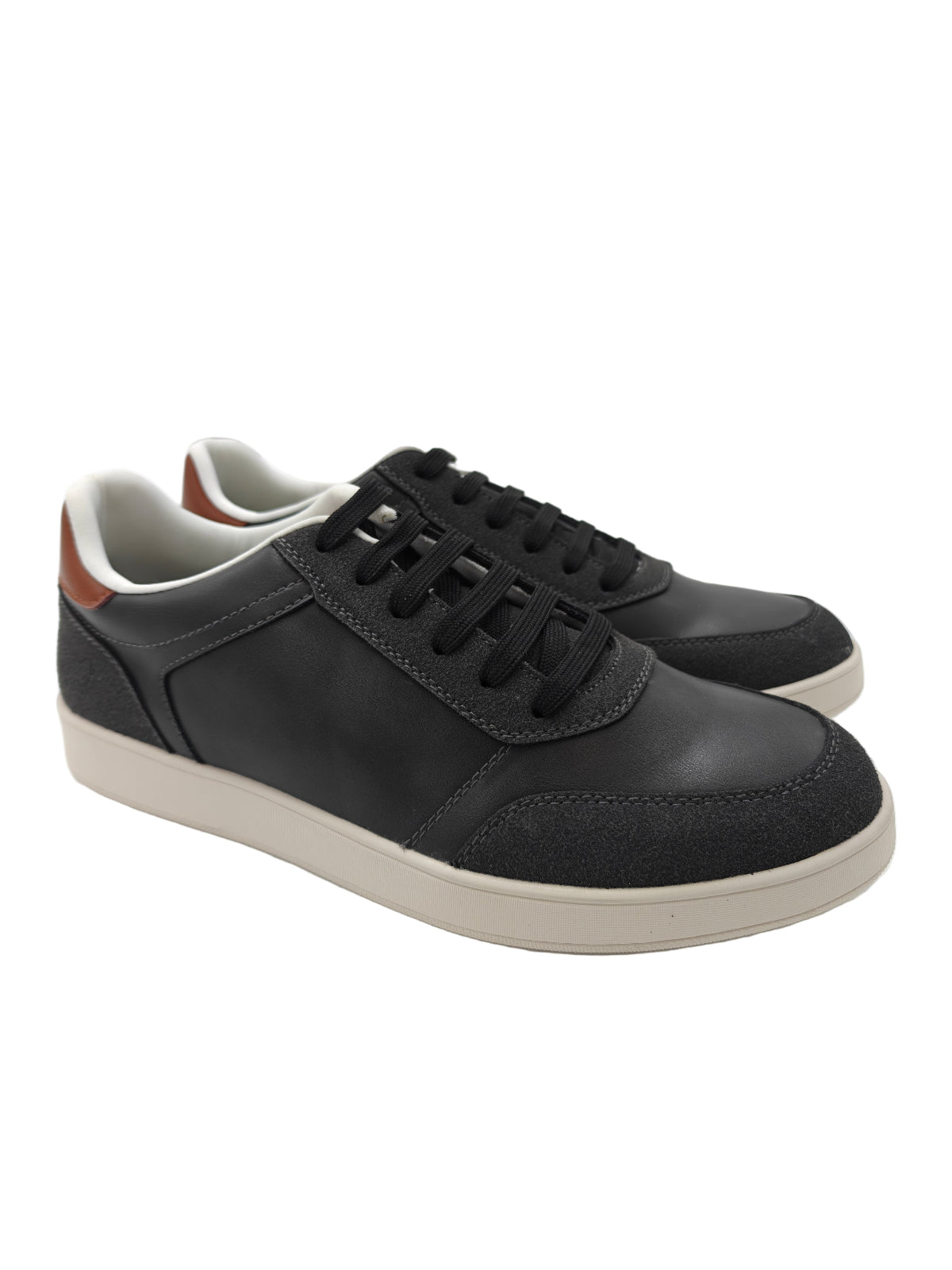 Charcoal grey sneakers with white soles on a white background