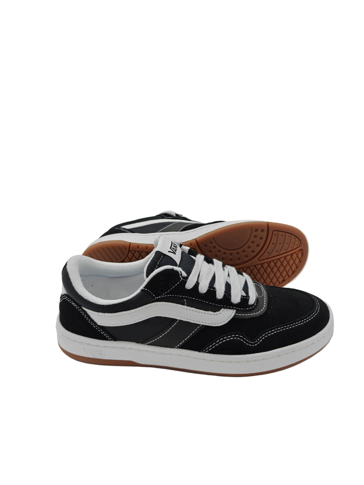 Black and white sneakers with brown soles on a white background