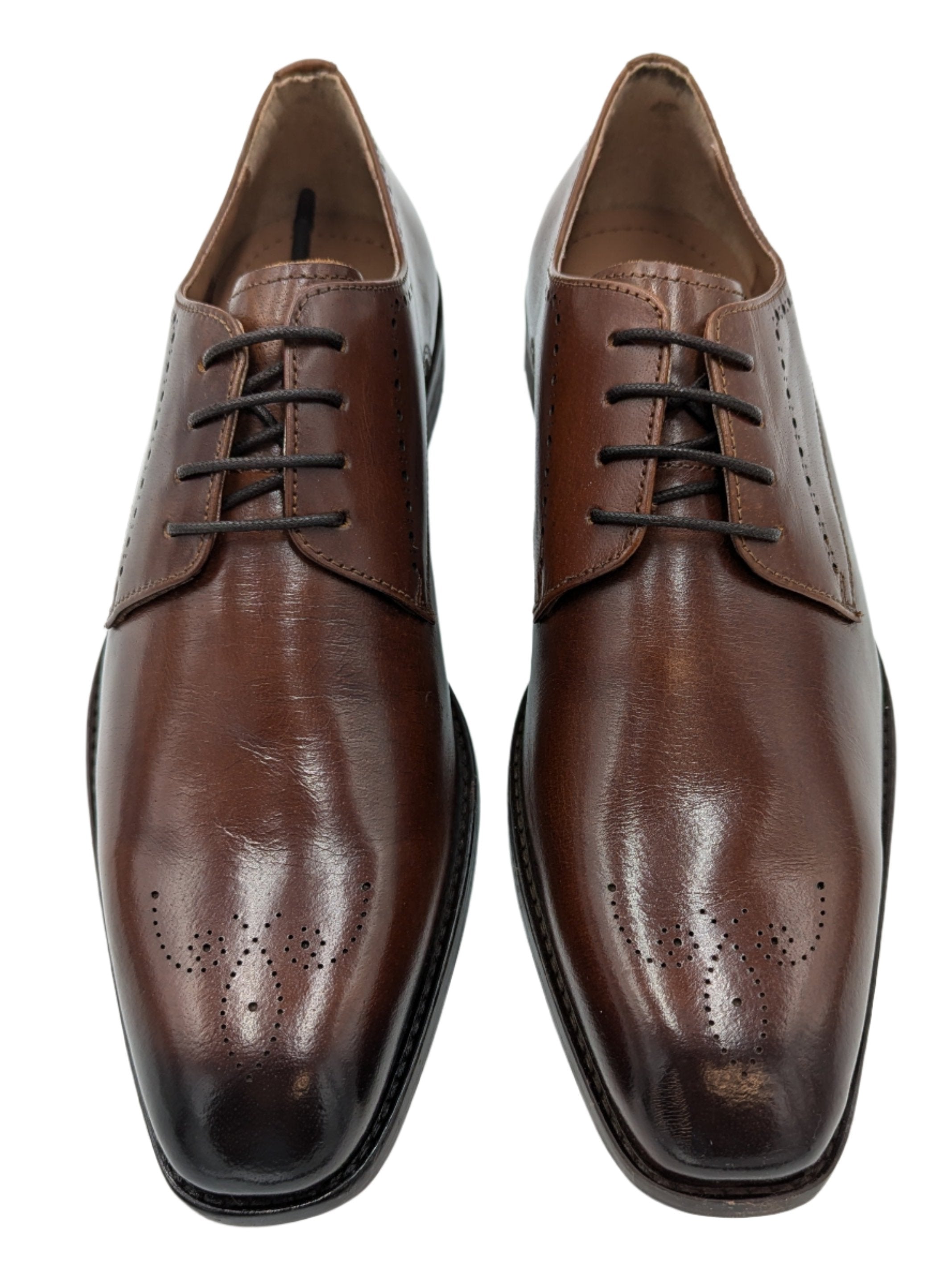 Introducing Benetti Menswear's new Thomas Burgundy Leather shoe. Crafted with luxurious leather and a stylish brogue toe design, these shoes are perfect for any formal occasion. Elevate your style and stand out at weddings, graduations, or any special event.-Front view