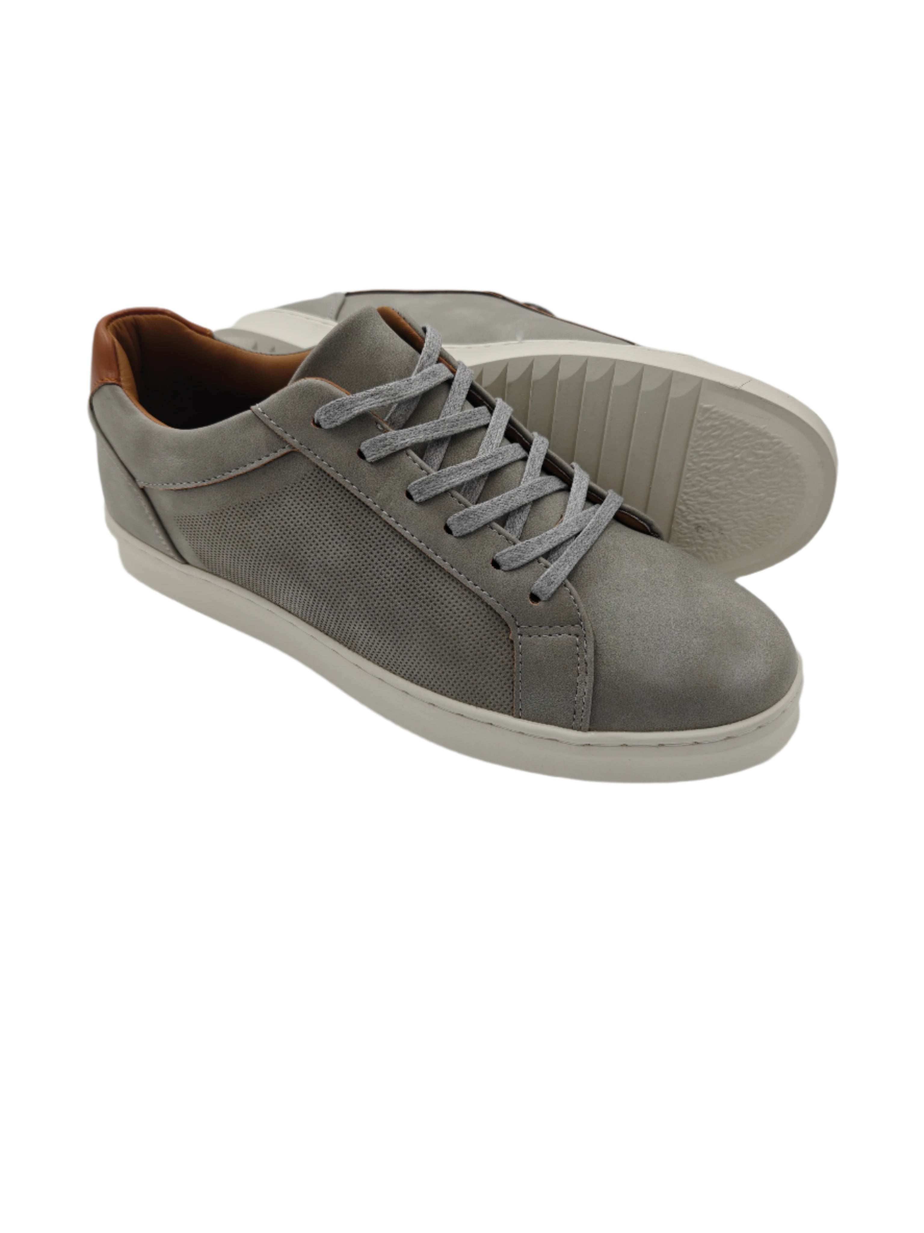Gray sneakers with white soles on a light gray background