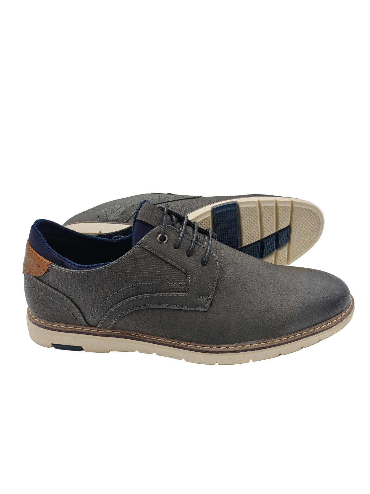 Gray casual shoe with a brown heel tab on a white background