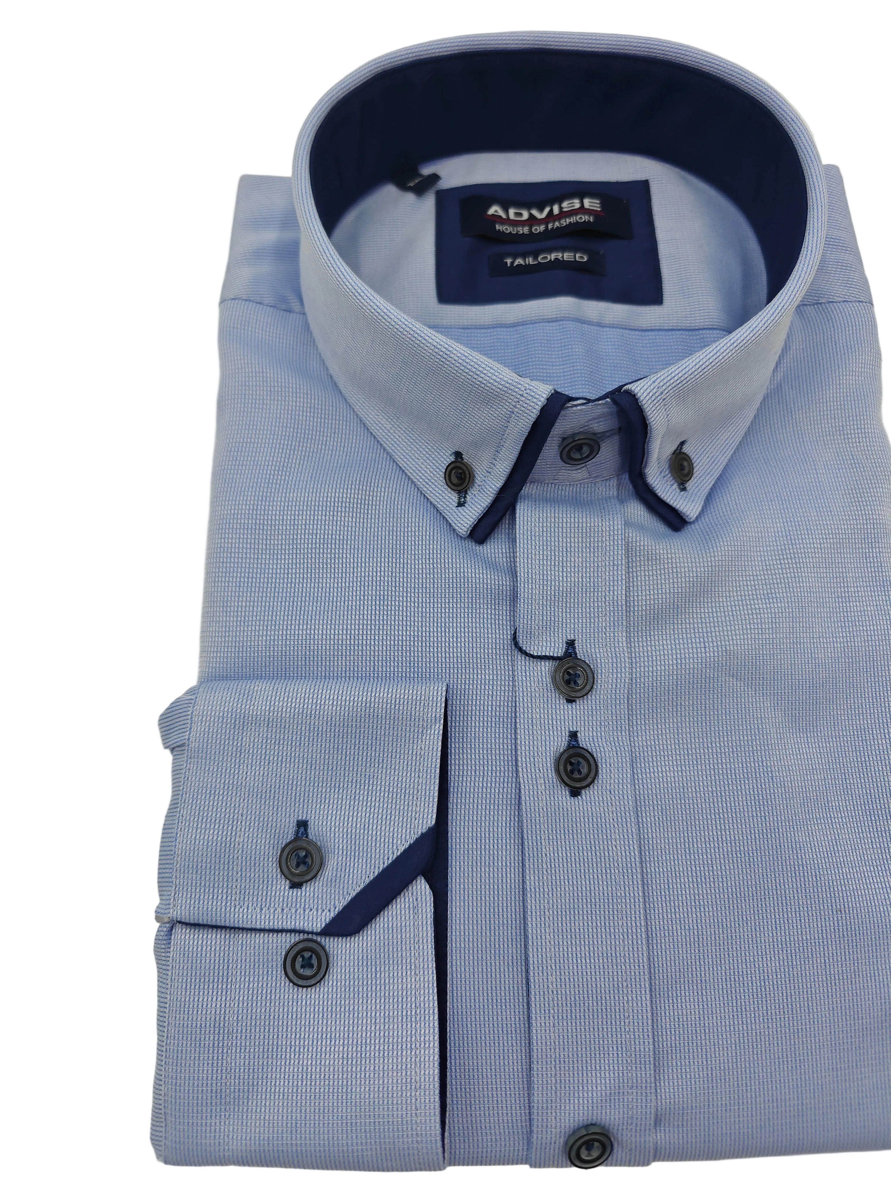 Folded light blue dress shirt with dark collar and buttons on a white background