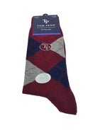 Angled view of Tom Penn burgundy argyle sock showing TP logo and cotton label