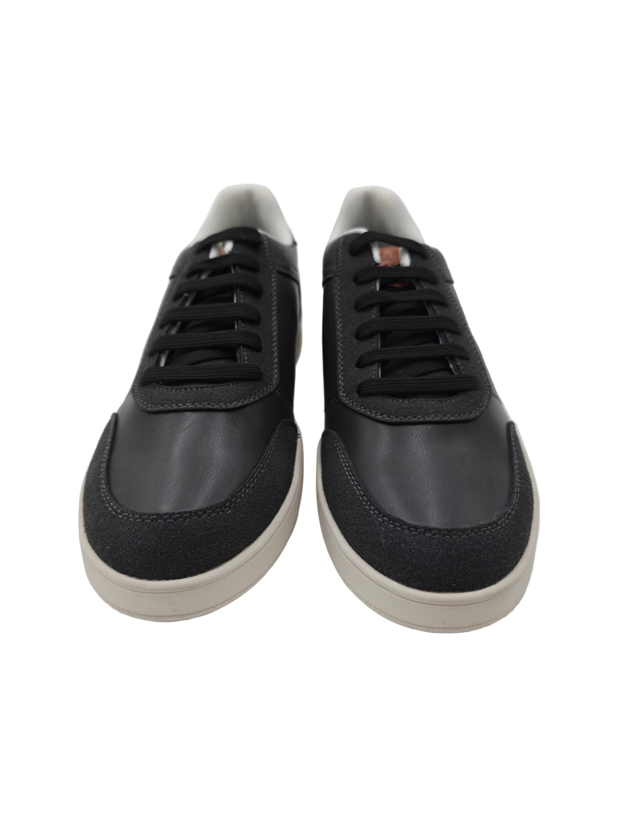 Pair of Charcoal grey sneakers with white soles on a white background