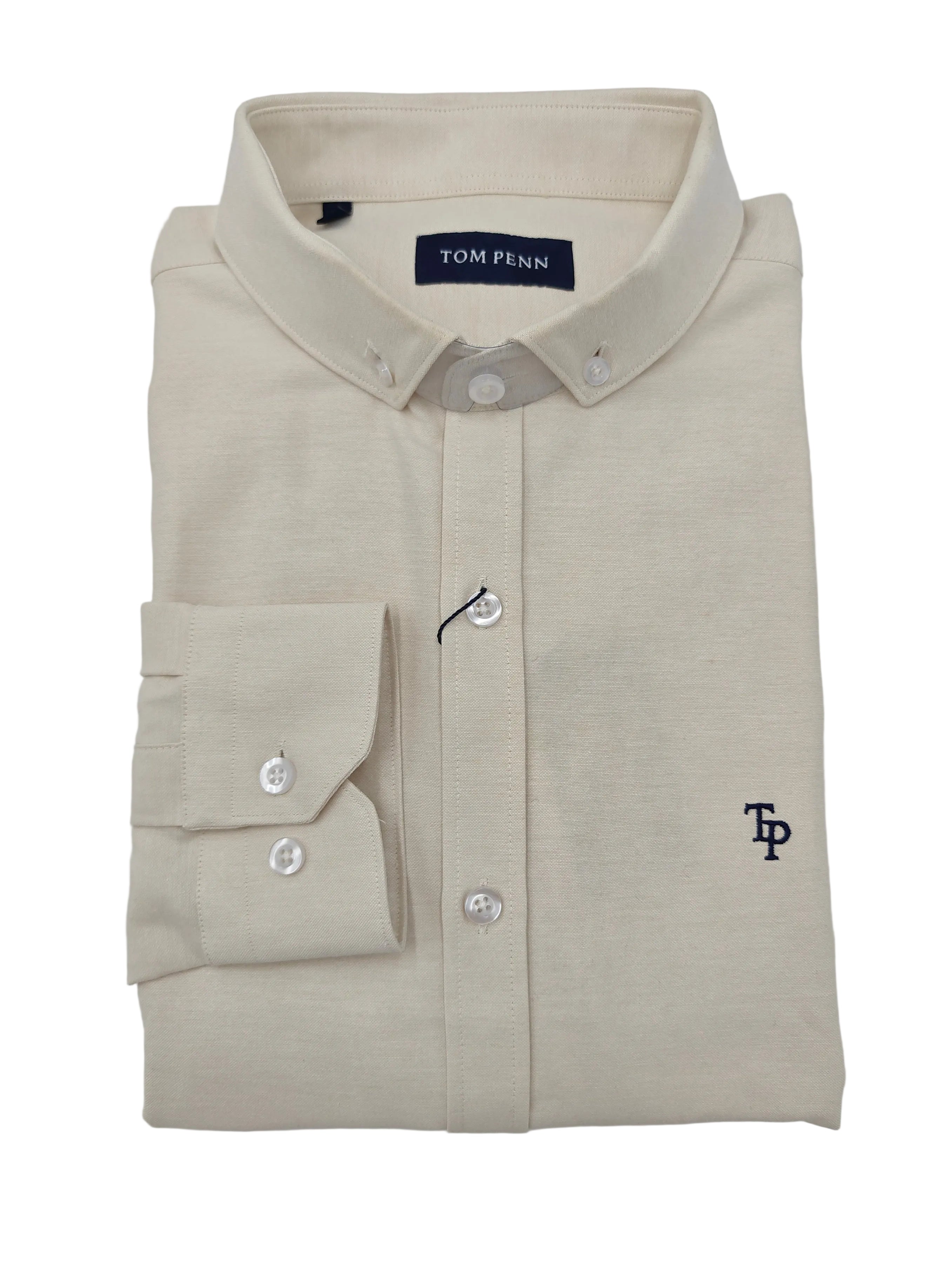 Folded beige Tom Penn shirt with a brand TP logo on a light gray background