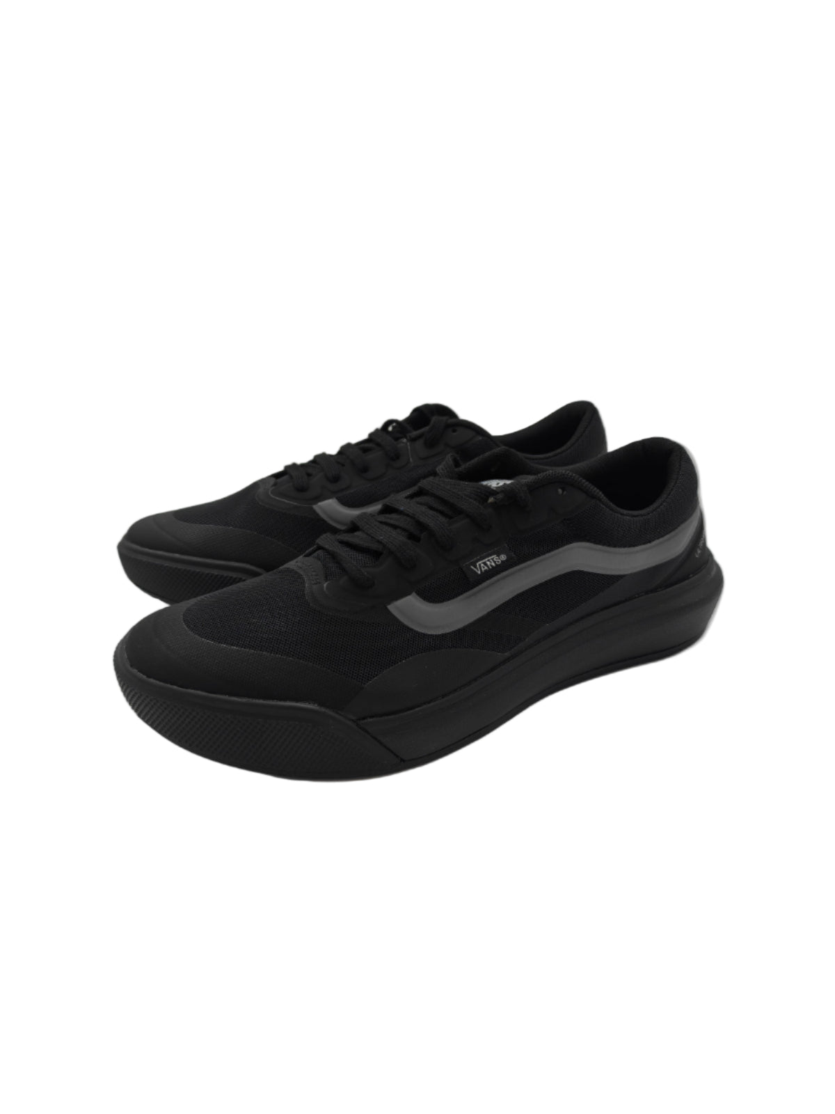 Black sneakers on a white surface with a reflective background