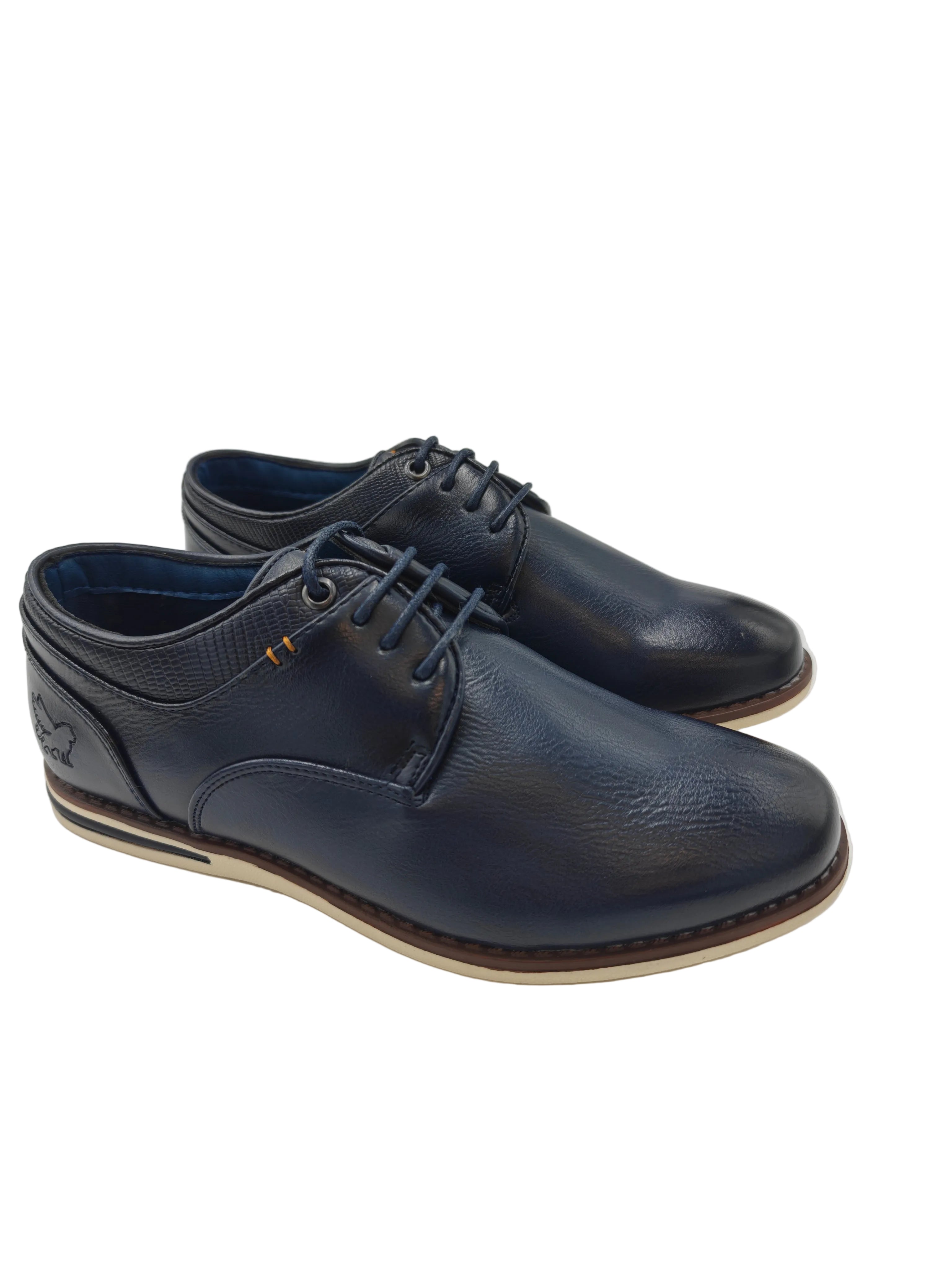 Pair of navy blue pu leather shoes on a white background