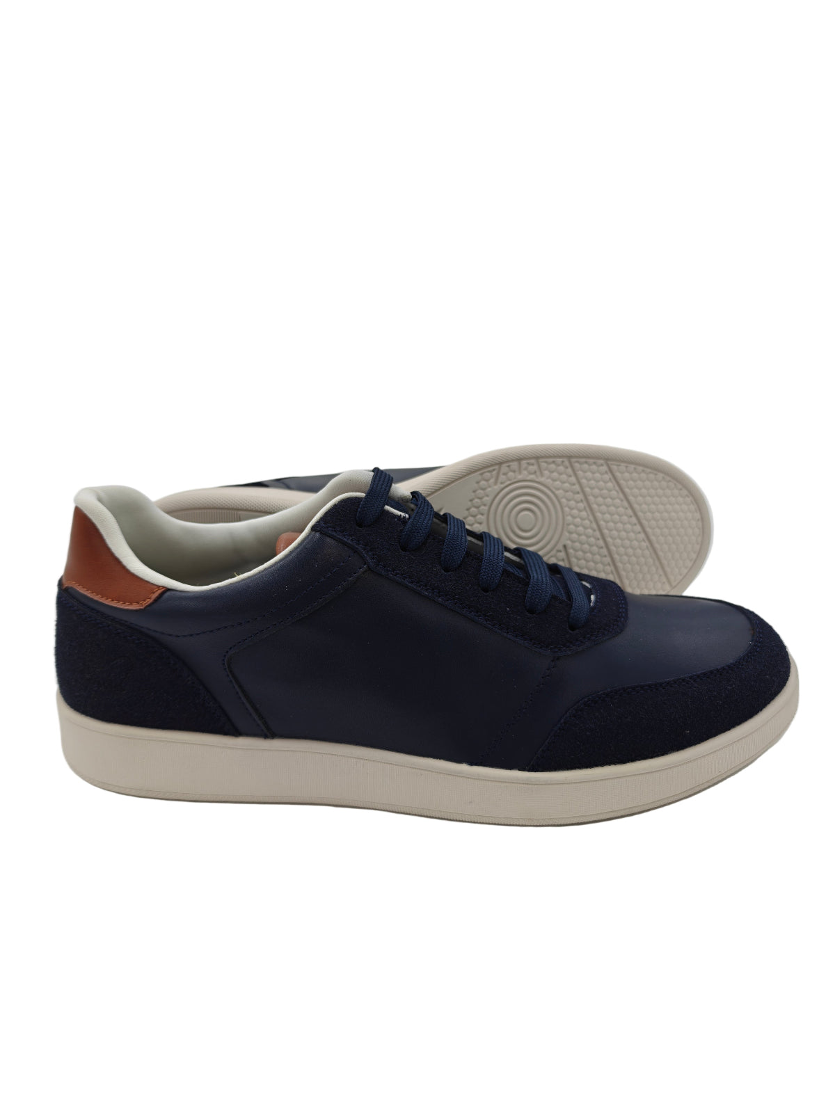 Navy blue sneakers with white soles on a white background