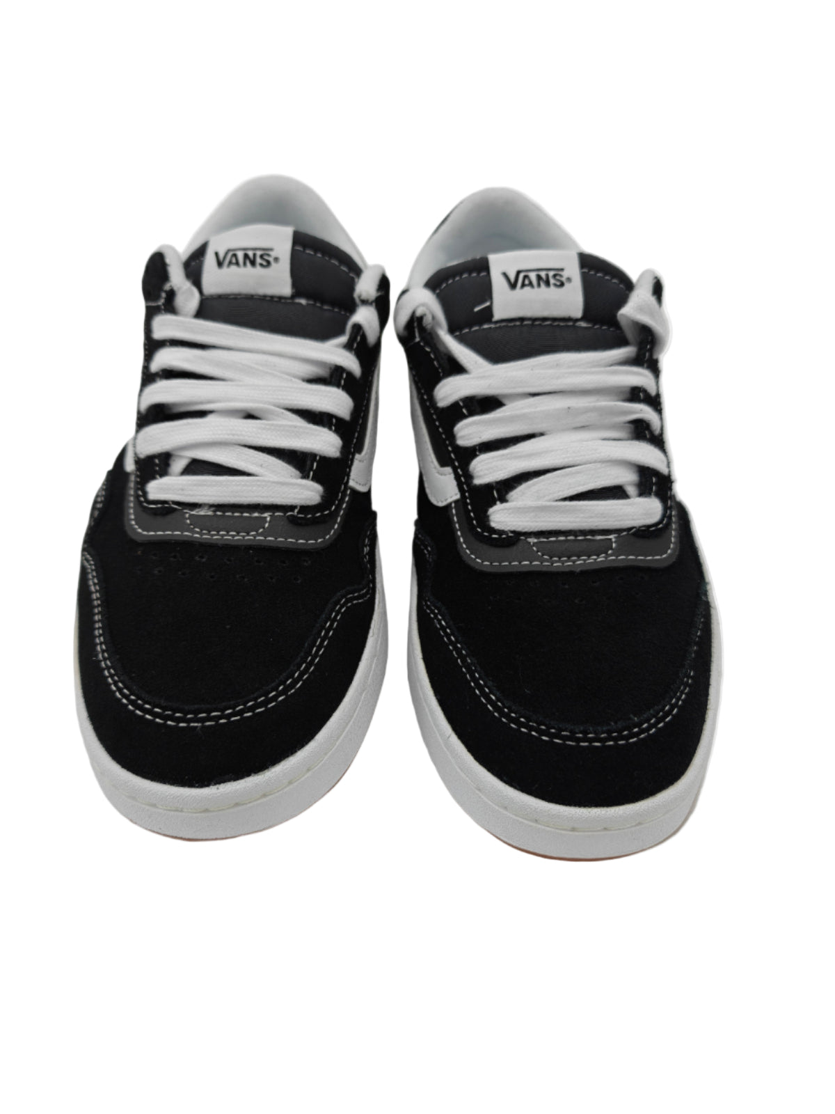 Pair of black and white sneakers with visible Vans branding on a light gray background