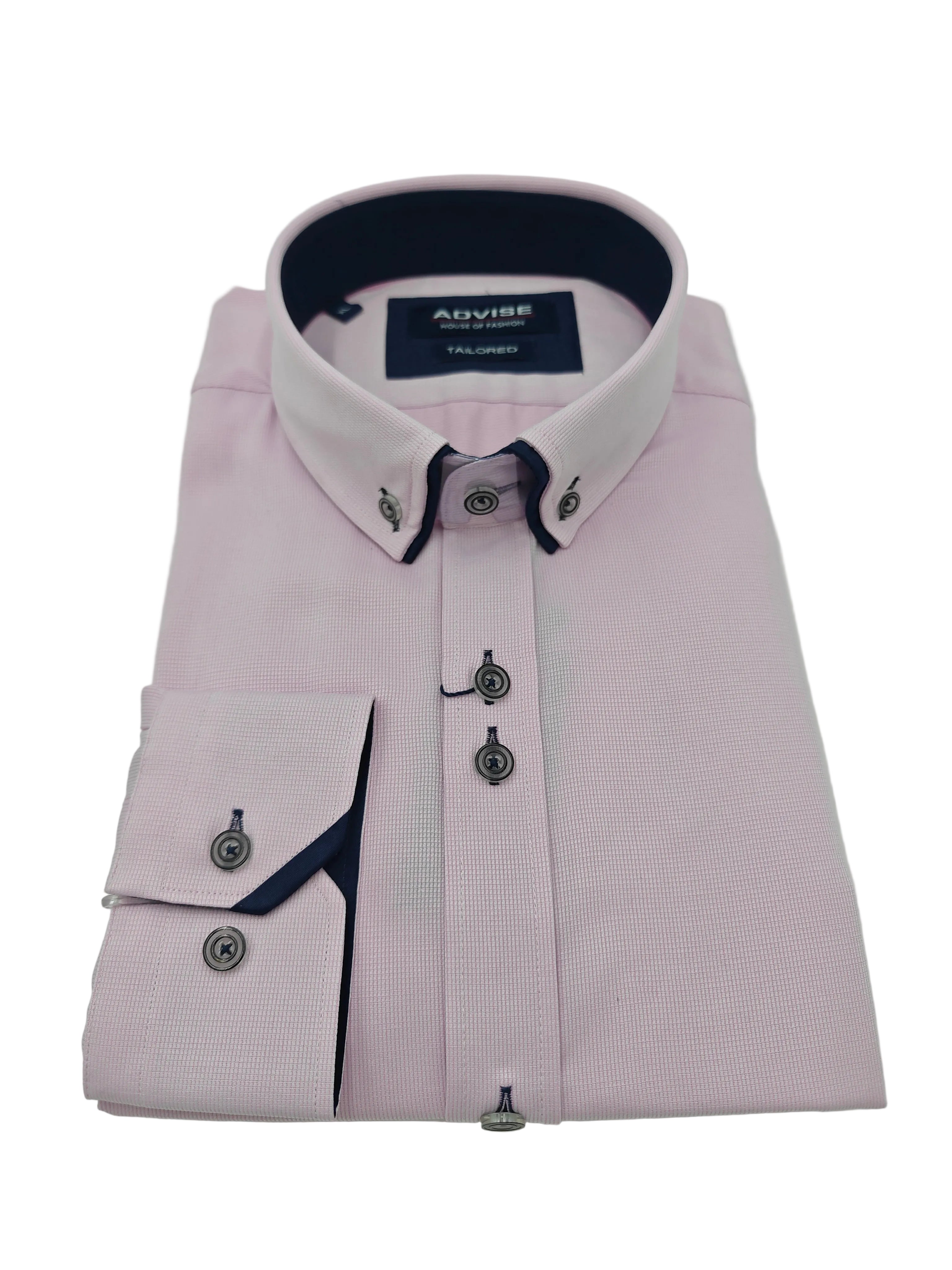 Folded light pink dress shirt with dark collar and buttons on a white background