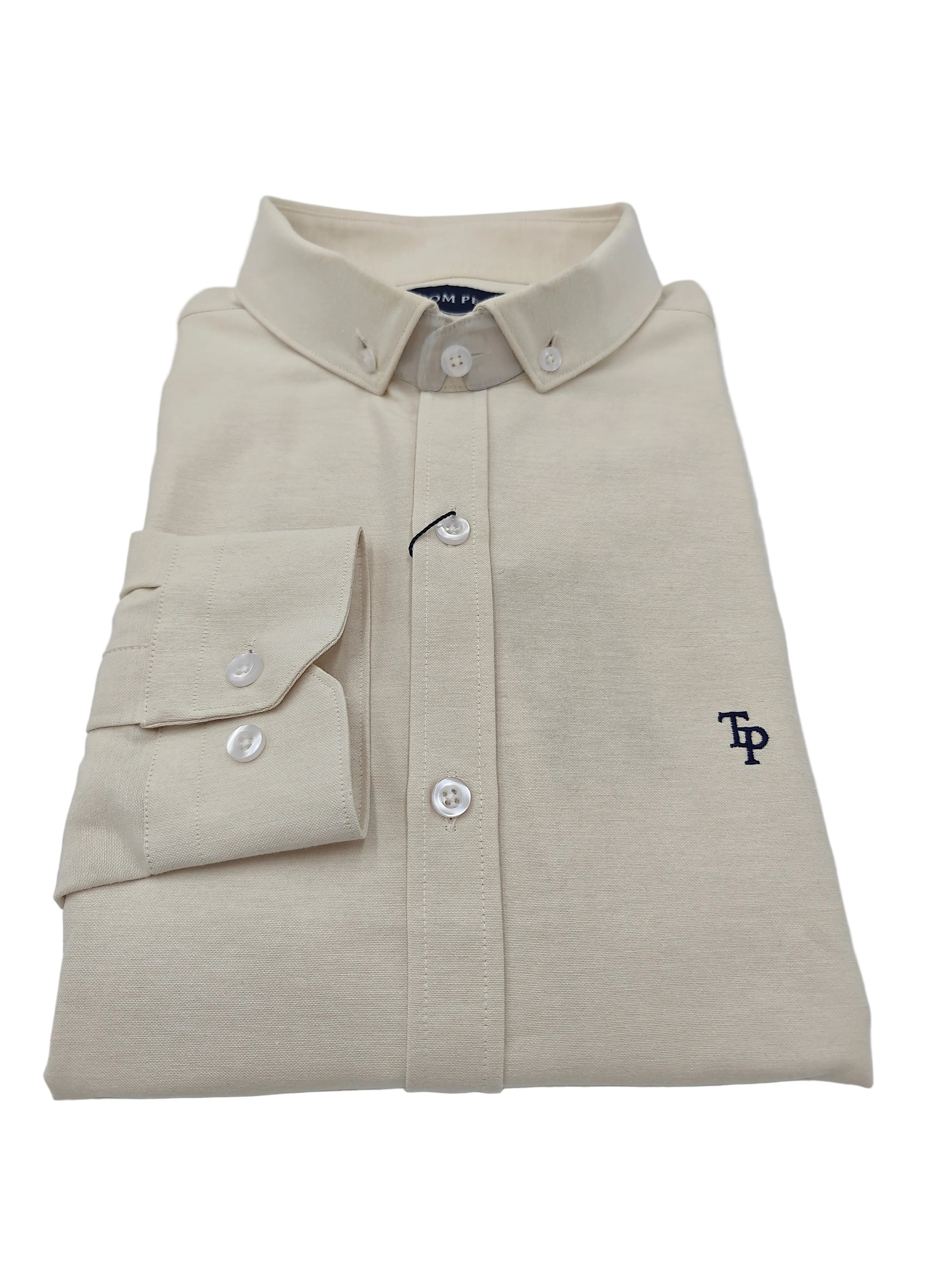 Folded beige Tom Penn shirt with a logo on a white background