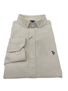 Folded ivory Tom Penn Oxford shirt on white background