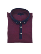 Upper front view of Tom Penn men’s burgundy melange polo shirt with navy tipped cuffs and chest logo