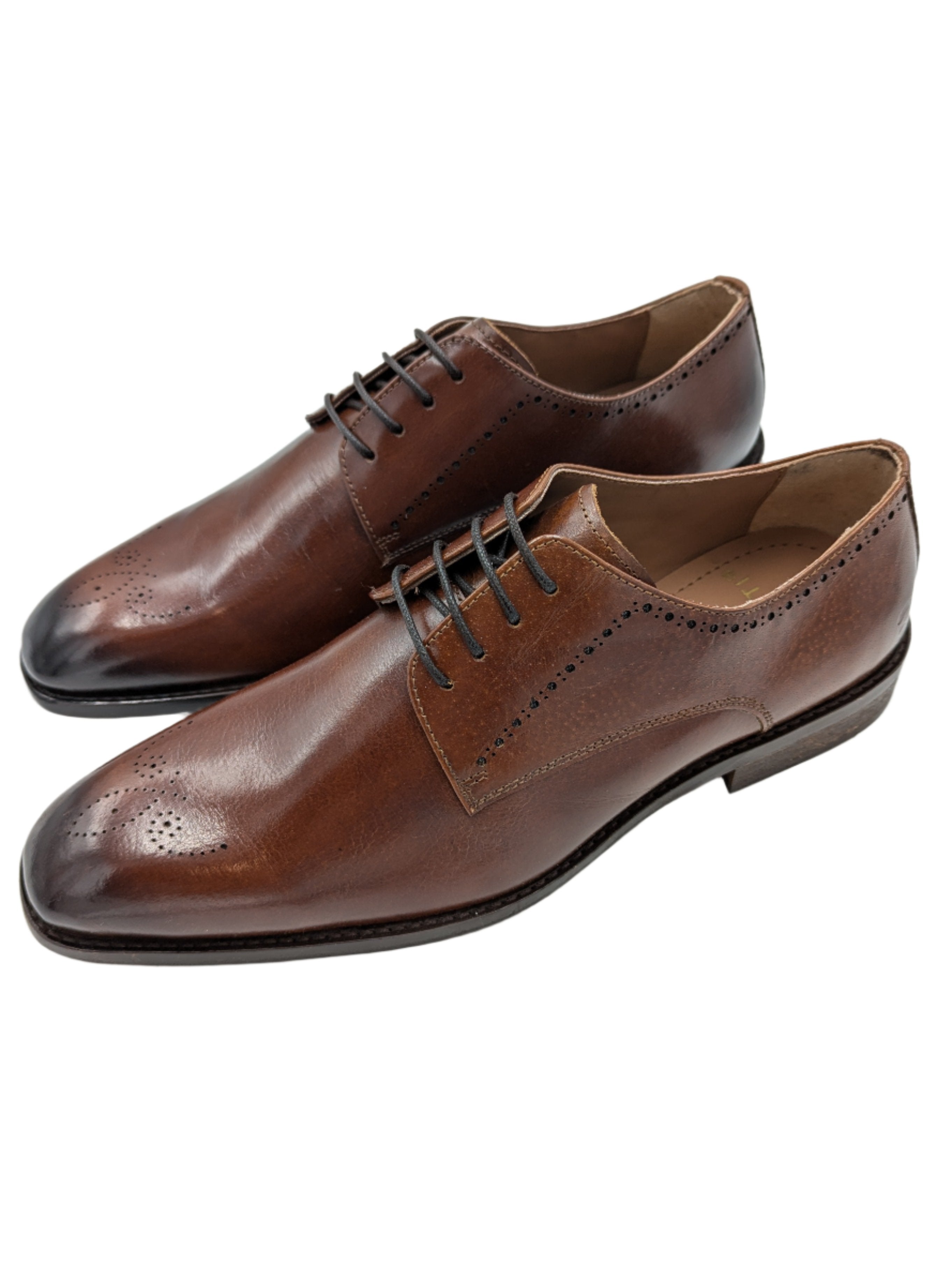 Introducing Benetti Menswear's new Thomas Burgundy Leather shoe. Crafted with luxurious leather and a stylish brogue toe design, these shoes are perfect for any formal occasion. Elevate your style and stand out at weddings, graduations, or any special event.