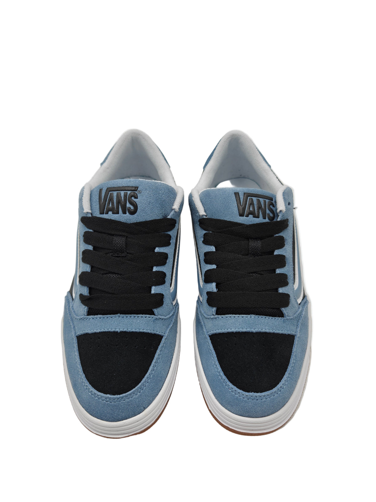 Pair of blue Vans sneakers on a light gray background