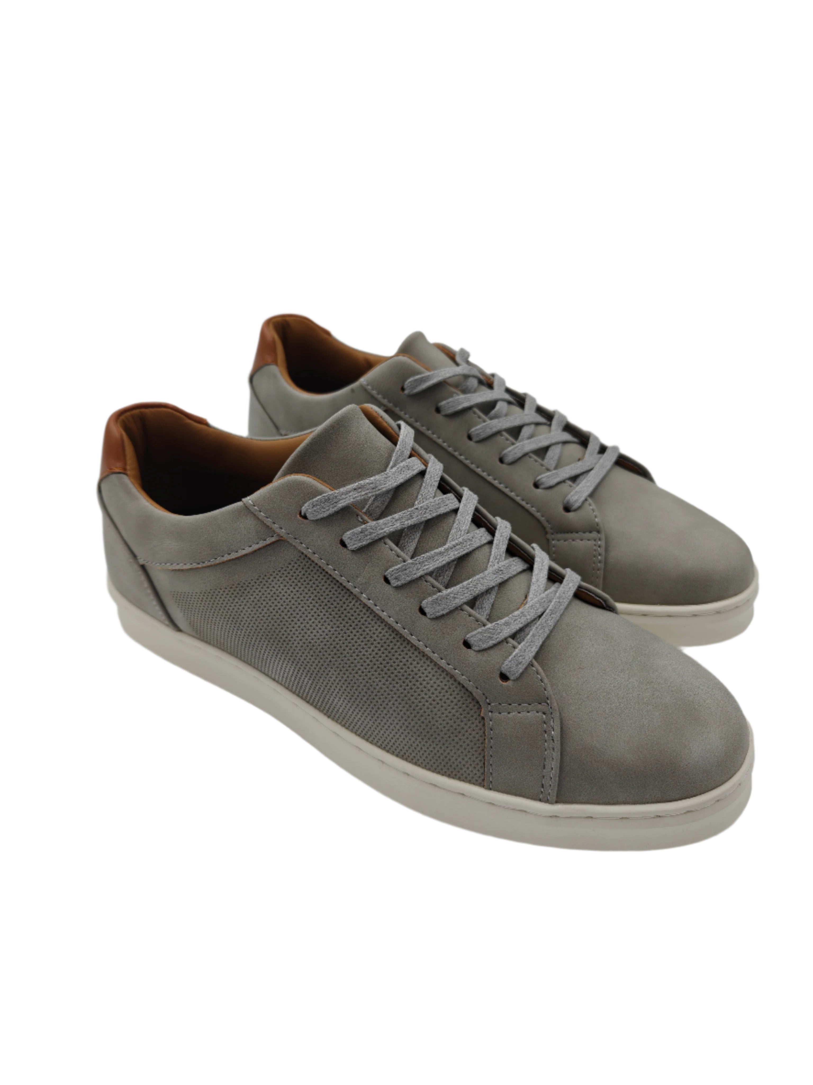 Pair of gray sneakers with brown accents on a white surface