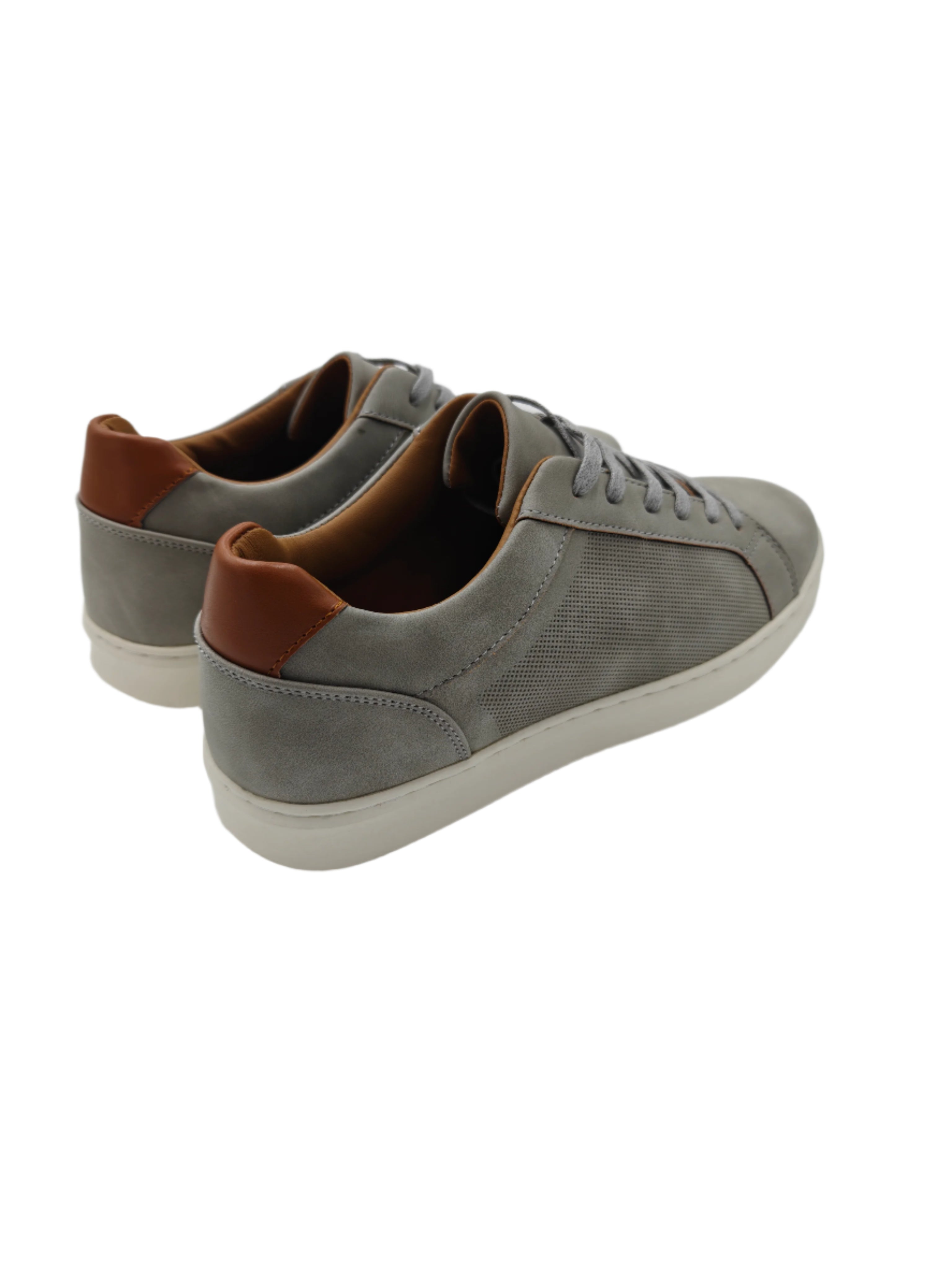 Pair of gray sneakers with brown accents on a white surface