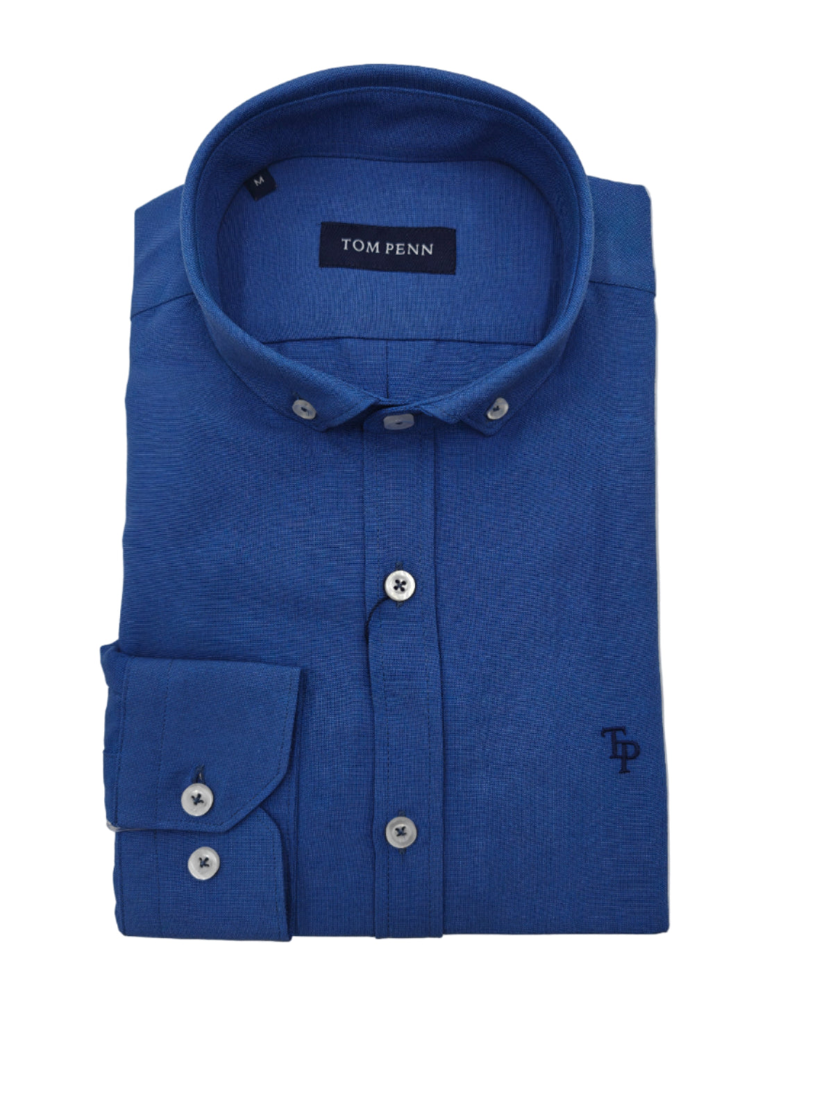 Folded blue shirt with 'Tom Penn' label on a light gray background