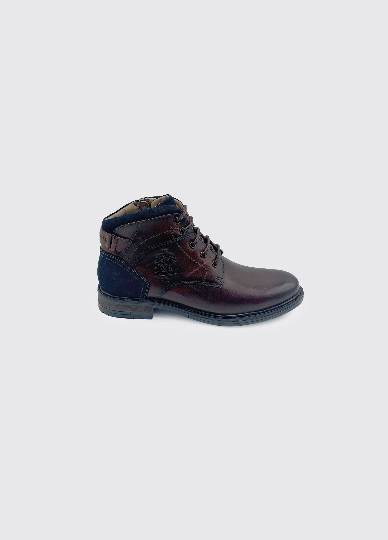 Brown leather boot with blue accents on a light gray background
