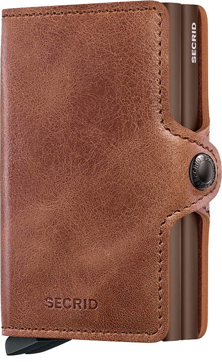 Brown Secrid wallet with a metallic accent on a light brown background