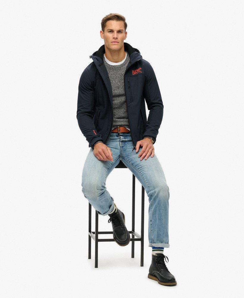 Hooded Soft Shell Trekker Navy Jacket-Model sitting down